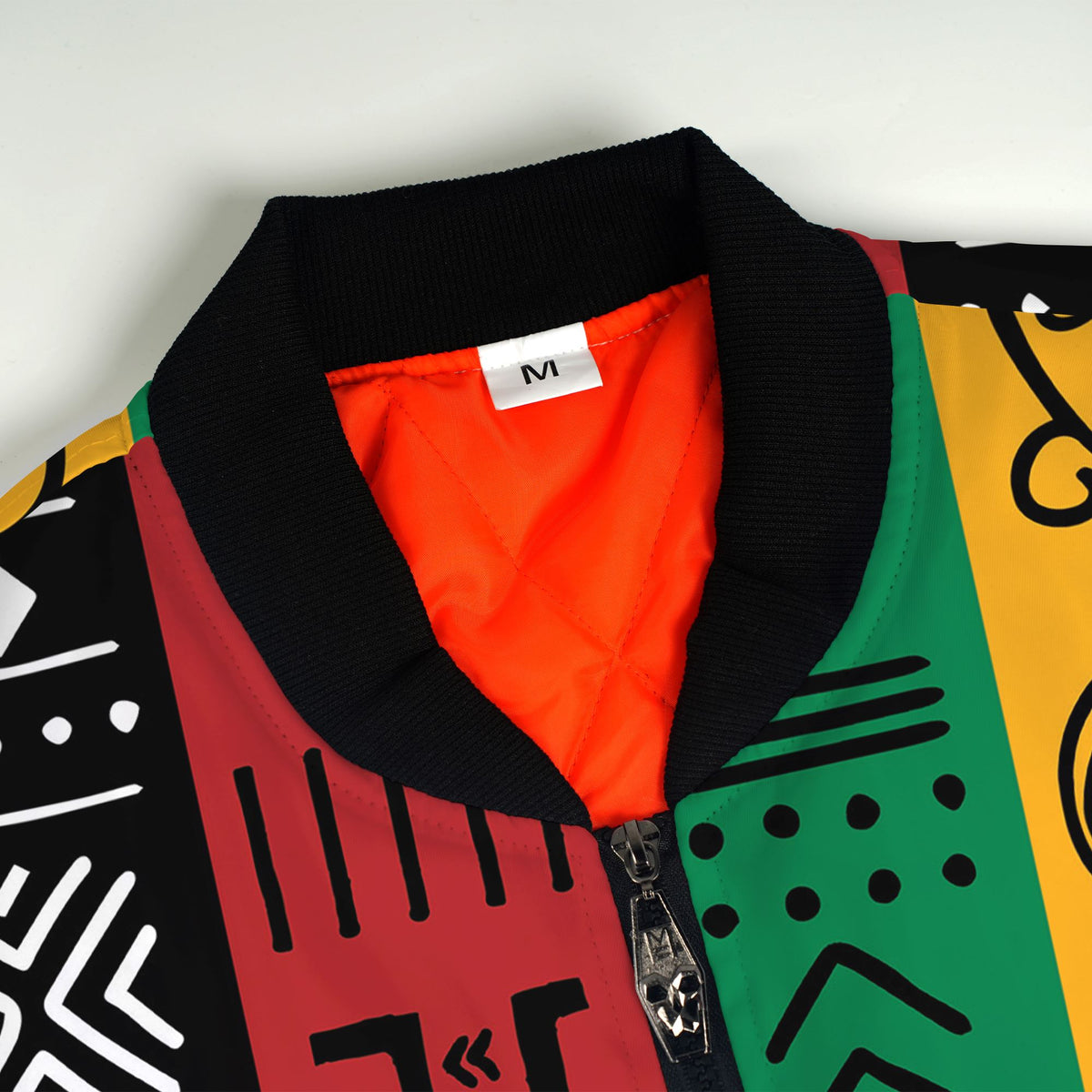 African Symbols in Pan-African Colors Bomber Jacket Bomber Jacket Version 2 Zootop Bear 